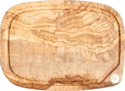A wooden cutting board with a juice groove.