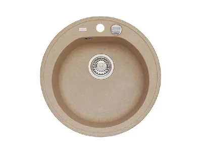 A top-down view of a round, beige granite kitchen sink with a drain and faucet holes.