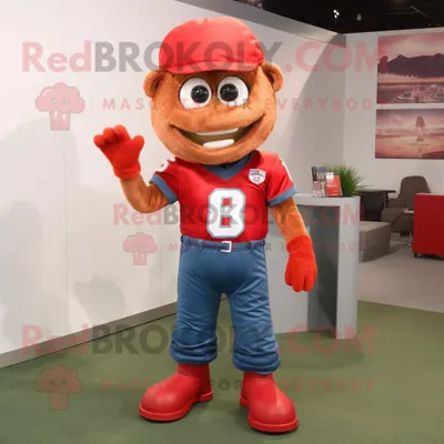 Produktbild von Roter REDBROKOLY Maskottchen Kostüm mit American-Football-Helm bekleidet mit Jeans und Hosenträgern