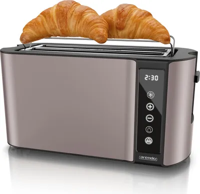 A toaster with two croissants on top, displayed on a reflective surface.