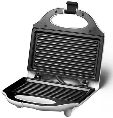 An open electric contact grill with ribbed plates.