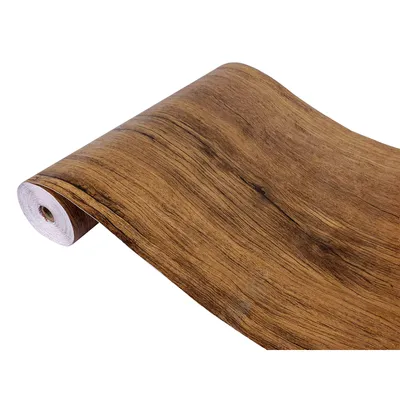 A roll of self-adhesive wallpaper with a wood grain pattern.