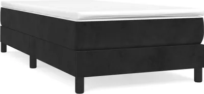 A black boxspring bed frame with a white mattress on top, shown from a side angle on a white background.