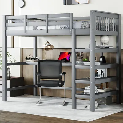 A loft bed with a desk and shelves underneath, set up in a room.