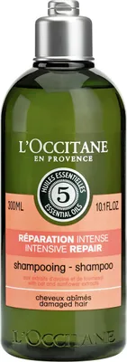 A bottle of L'Occitane Intensive Repair Shampoo.