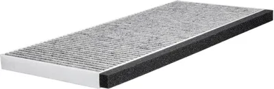 A car cabin air filter, laid diagonally on a white background. The filter is rectangular with a pleated gray filtering material and a black foam seal along one side.