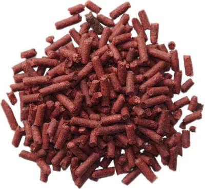 A pile of small, cylindrical, reddish-brown pellets.