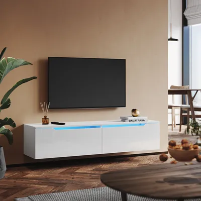 A modern living room with a wall-mounted TV and a white TV cabinet with LED lighting.