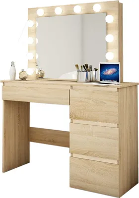 A light wood vanity table with a large mirror surrounded by lights, drawers on the right side, and makeup accessories on the surface.