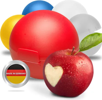 Several colorful round containers and a red apple with a heart carved into it.