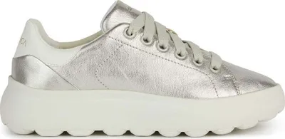 A side view of a single gold sneaker with a white sole.