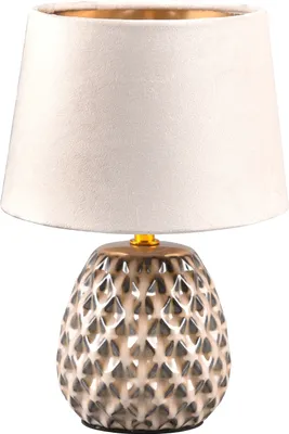 A table lamp with a textured ceramic base and a fabric lampshade.