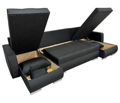 A black U-shaped sectional sofa with its storage compartments open, revealing cushions inside.
