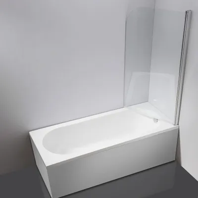 A white bathtub with a clear glass shower screen attached.