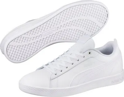 A pair of white Puma Smash Wns v2 sneakers, with one shoe shown from the side and the sole of the other shoe shown from underneath.