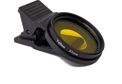 A black clip-on yellow filter lens for a smartphone camera, shown on a white background.