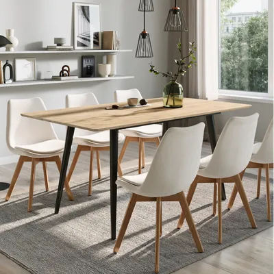 A dining table and chairs set in a modern dining room setting.