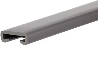 A close-up, angled view of a dark gray plastic handrail profile against a white background.