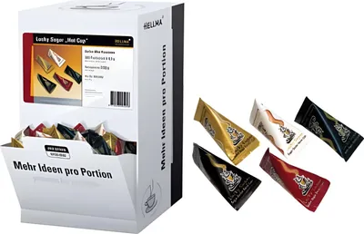 A display box of Hellma Lucky Sugar portions next to several individual sugar portions.