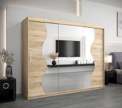 A bedroom setting with a large wardrobe featuring a TV niche.