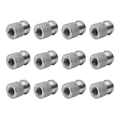 A product shot of twelve threaded inserts arranged in three rows of four on a white background.