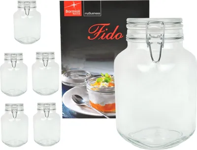 A collection of glass jars and a box with product information.
