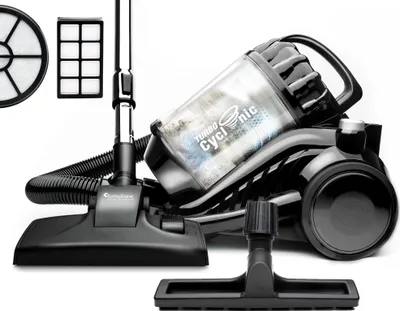 A black canister vacuum cleaner with its attachments and filters, displayed against a white background.