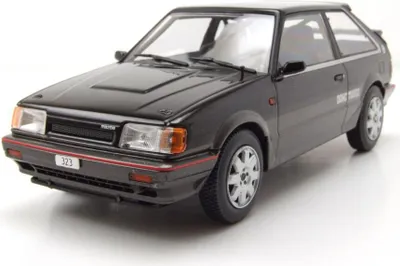 Produktbild von Whitebox 124222 Mazda 323 4WD Turbo 1989 schwarz grau 1:24