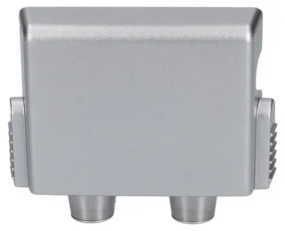 Side view of a silver electronic device with two connectors at the bottom and ventilation grilles on the sides.