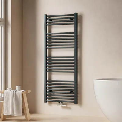 A modern bathroom with a towel radiator, a stool with a towel, and a bathtub.