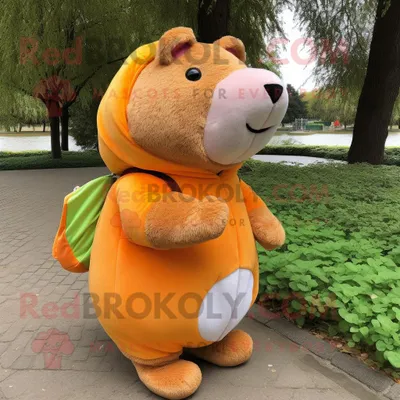 Productafbeelding van Peach Capybara mascotte REDBROKOLY kostuum karakter gekleed met een jas en omslagdoeken
