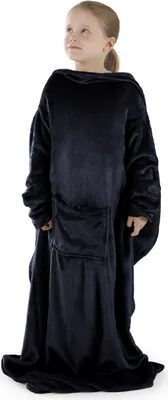 A young girl wearing a dark blue blanket with sleeves.