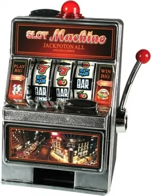 A close-up studio shot of a miniature slot machine.