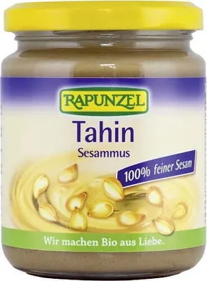 A jar of Rapunzel Tahin (Sesammus) with sesame seeds depicted on the label.