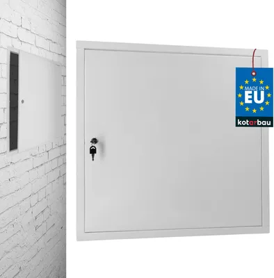 A white metal revision door with a key lock is shown mounted on a white brick wall. A blue tag with 'MADE IN EU' and 'kotarbau' is attached to the door.