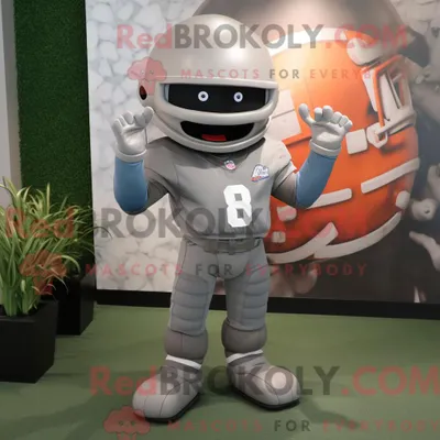 Produktbild von Grauer REDBROKOLY American Football Helm Maskottchen Kostüm Charakter bekleidet mit einem Baseball-T-Shirt und Stirnbänder
