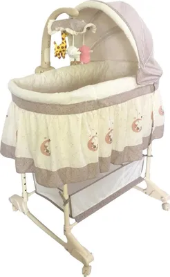 A baby bassinet with a canopy and mobile.