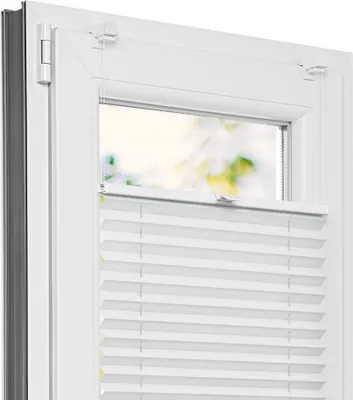 A close-up view of a white pleated blind installed on a white window frame.