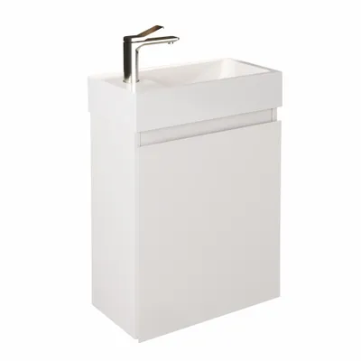A white bathroom vanity with a sink and faucet against a white background.
