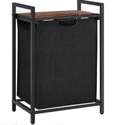 A freestanding laundry basket with a shelf, made of metal and fabric, with a wooden top.