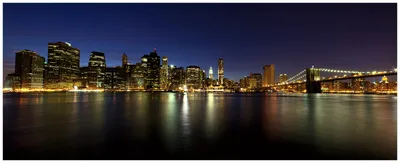 Produktbild von Wallario Wandbild aus Acryl, 125 x 50 cm, freischwebende Optik - New York Skyline - Brooklyn Bridge und Manhattan am Abend