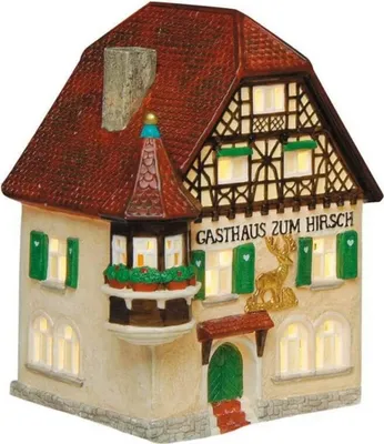 A miniature, illuminated model of a German-style inn called 'Gasthaus zum Hirsch'.