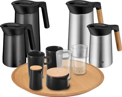 A collection of thermoses, mugs, and glasses arranged on a wooden tray.