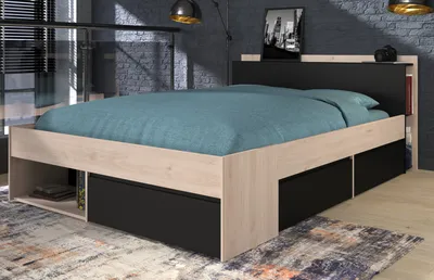 A bed with storage drawers in a bedroom setting.