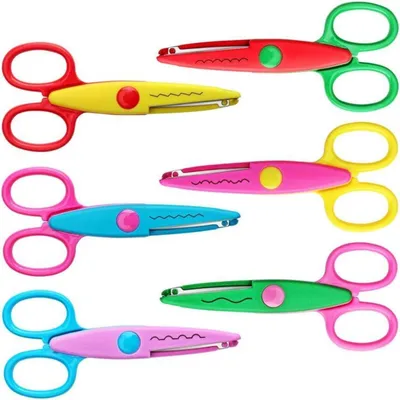 A collection of colorful craft scissors arranged in rows against a white background.