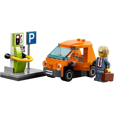 A LEGO toy set depicting an electric car charging station with a car and a minifigure.
