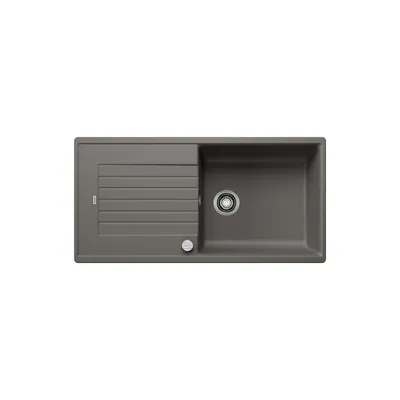 A top-down view of a gray kitchen sink with a drainboard.