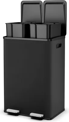 A black dual-compartment trash can with silver foot pedals.