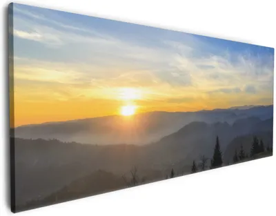 Produktbild von Wallario Premium Leinwandbild Sonnenaufgang über dem Schwarzwald in Größe 60 x 150 cm