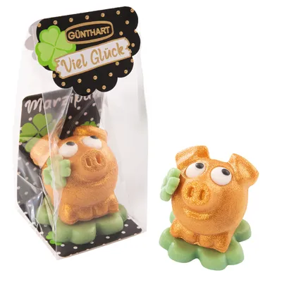 Produktbild von 1 Stück Marzipan-Schweinchen gold auf Kleeblatt im Cellophanbeutel